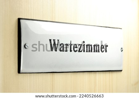 enamel sign on the door to the waiting room of a German doctor's office (translation: waiting room)