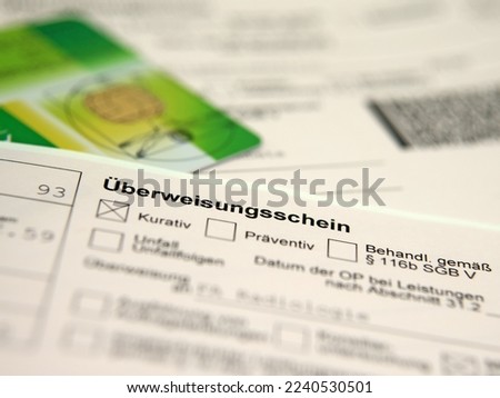 Referral form to the specialist with the text "Überweisungsschein", translation" Referral slip"