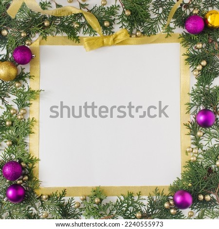 Christmas square frame design with vibrant gold and magenta ornaments on nature elements. Flat lay design.