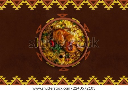 The national Saudi Arabian dish chicken kabsa with roasted chicken quarter and almonds, mandy or kabsa arabic food.       Royalty-Free Stock Photo #2240572103
