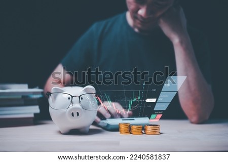 money investment management concept man calculating using machine managing household finances at home, make calculations on calculator paying bills, account taxes , expenses, saving plans piggy bank, 