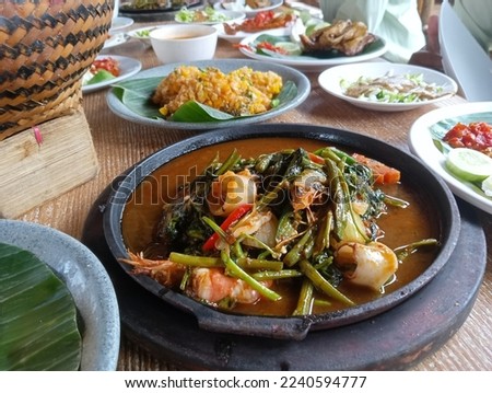 lunch menu, side dishes on the table with various kinds of vegetables, meat, chicken, rice and chili sauce