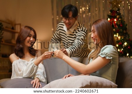 New Year party concept, Group of friends clinking champagne with happiness in new year party.