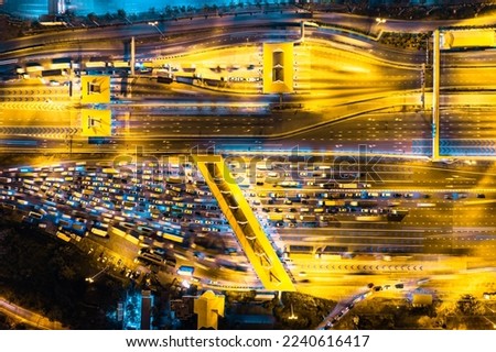 Aerial view of Cars Passing Through The Automatic Point Of Payment On motorway Toll Road at night. Point Of Toll Highway, Toll Station. Highway Toll Plaza Or Turnpike Or Charging Point, Expressway Royalty-Free Stock Photo #2240616417