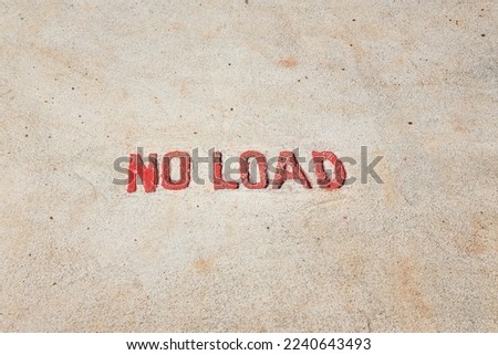 "No load" sign on the concrete ground at the construction working site, to demonstrate this area unable to place the heavy object due to it fragility. Site and symbol in the industrial work place.