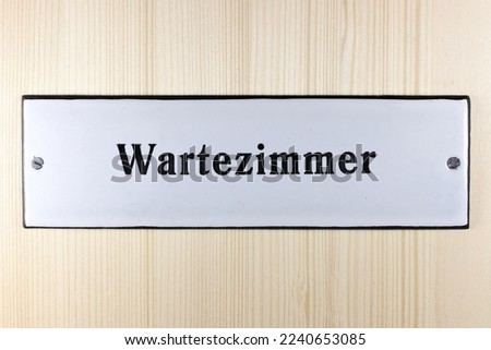 enamel sign on the door to the waiting room of a German doctor's office (translation: waiting room)
