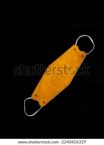 yellow colour of  facemask, isolated with black  background