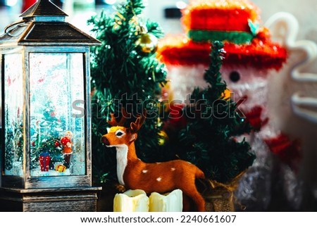 Christmas decoration concepts with snowman and reindeer. small pine tree.