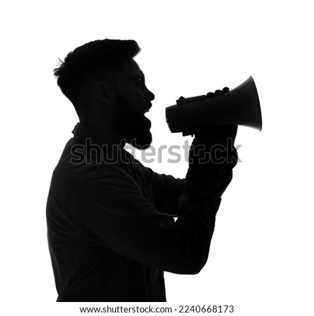 Silhouette of young man shouting into megaphone on white background Royalty-Free Stock Photo #2240668173