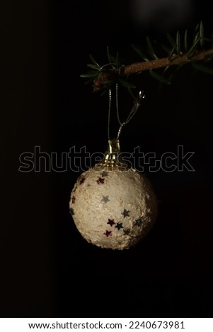 White Christmas globe found in a natural tree 