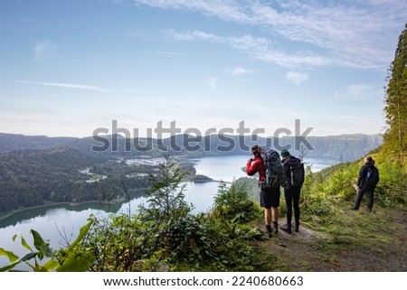 Group of hikers enjoying the scenic views of São Miguel island in the Azores Royalty-Free Stock Photo #2240680663