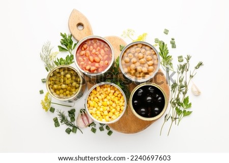 Stocks of canned food, long-term processed vegetables. Royalty-Free Stock Photo #2240697603