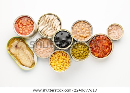 Canned food on a white background, a donation for people in crisis, long-term storage stocks. Royalty-Free Stock Photo #2240697619