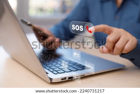 SOS with smartphone and Laptop concept, Woman hands holding mobile phone Emergency app in home, call phone, Chat message icon, Emergency application from smartphone for elderly, call for help. Royalty-Free Stock Photo #2240731217