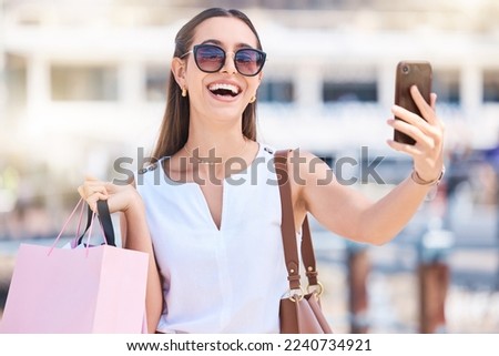 Phone, shopping or woman taking selfie for a social media profile picture in of city of Las Vegas on summer holiday. Fashion, content creator or happy girl influencer smiles with luxury shopping bag