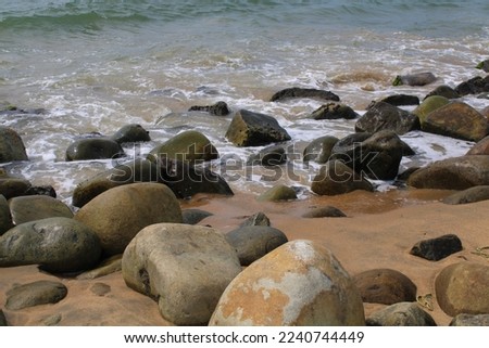 Sea water wave gentle hit the stones at seashore