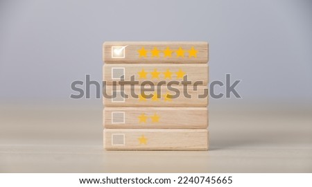 Wooden block showing five-star rating. Satisfaction survey concept, positive customer feedback, the best response from the product user experience. customer service