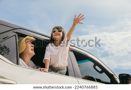 Happy family day. Asian mother father and children smiling sitting in compact white car looking out windows, Summer at the beach, Car insurance, Family holiday vacation travel, road trip concept