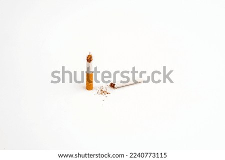 Broken cigarette isolated over the white background
