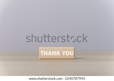 Wooden block showing a message with the word thank you. Letter writing concept. Congratulations, Appreciation, with Copy Space