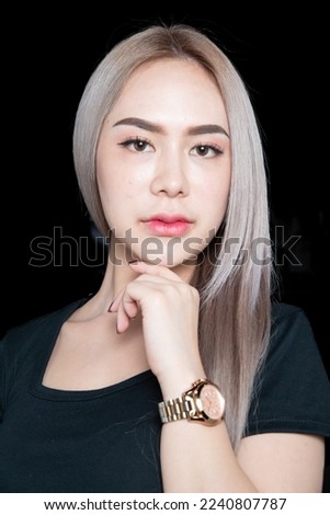 head shot of caucasian beauty girl ashen hair wear black t shirt with studio lighting for cosmatic black background