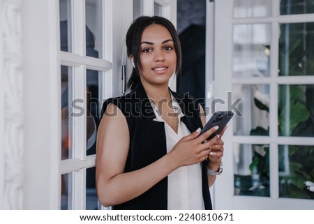 Close up portrait  of African American woman at home looking at camera  with adorable smile. Confident pretty brazilian girl having break at office. Mockup, happy people. Satisfied female student home