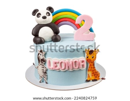 Children's panda cake with multi-colored rainbow. On a white background. Close-up.