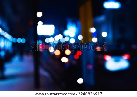 Defocused camera of city bustle in the middle of the night. the lights glitter