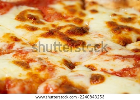 Pizza with mozzarella cheese texture as background. A close shot of a pizza. Macro photo. Margherita pizza.
