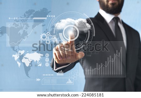 Businessman standing and working with touch screen technology