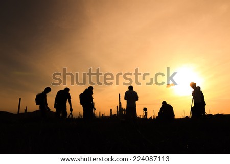 Silhouette of a photographer at sunrise.