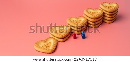 Two people stand in front of a heart-shaped cookie with the inscription "I love you". love background. Valentine's day concept, postcard, make an offer, marriage