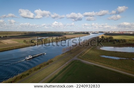 Barge on the Gent-Terneuzen Canal Royalty-Free Stock Photo #2240932833