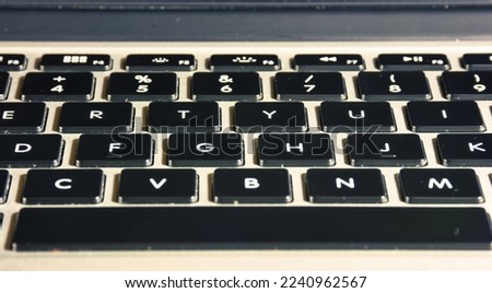Extreme close up of black and gray  old  vintage laptop keyboard. copy space. 