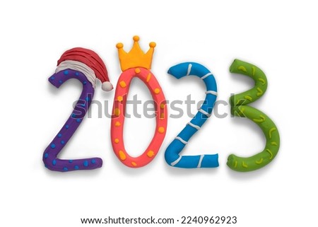 2023 numbers in colored cartoon style and Santa's hat all made by hand from plasticine. Happy New Year event poster, greeting card, 2023 calendar design, invitation to celebrate New Year