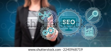 Woman touching a seo concept on a touch screen with her fingers