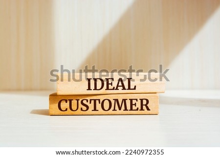 Wooden blocks with words 'IDEAL CUSTOMER'.
