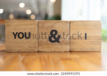 Word You and I. You and I blocks. The word love formed with small wooden blocks. selective focus.