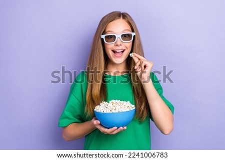 Photo of adorable cheerful lady wear stylish clothes tasting popcorn time home alone watch film isolated on purple color background