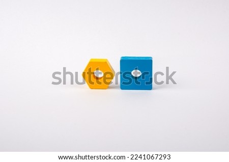 geometric shapes yellow and blue from toys on a light background. High quality photo
