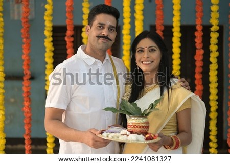 Happy South Indian couple celebrating Onam