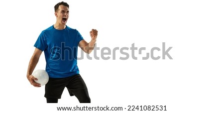 Winner emotions. Young male volleyball player with ball shouting isolated on white studio background. Concept of summer sports, gym, team sport, challenges. Flyer for ad