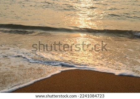 Sun reflection on water during sunset stock photo
