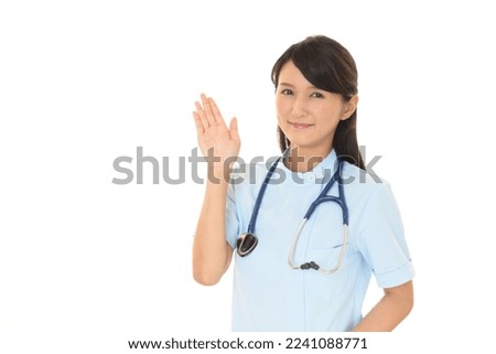smiling asian nurse in white background