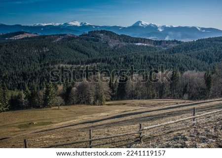 Empty pasture on hull landscape photo. Beautiful nature scenery photography with mountains on background. Idyllic scene. High quality picture for wallpaper, travel blog, magazine, article