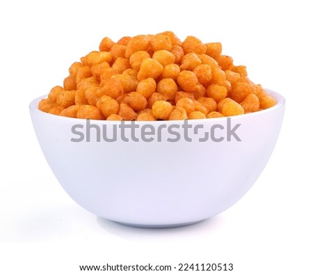 Indian namkeen (snacks) with masala boondi in a close-up on a white ceramic bowl. Royalty-Free Stock Photo #2241120513