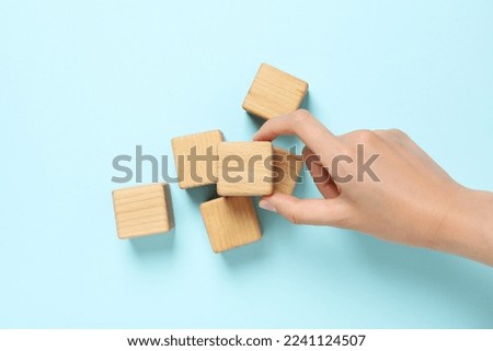 Blank wooden cubes for different concepts, top view Royalty-Free Stock Photo #2241124507