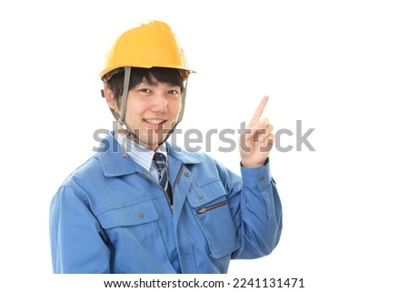 smiling asian male worker in white background