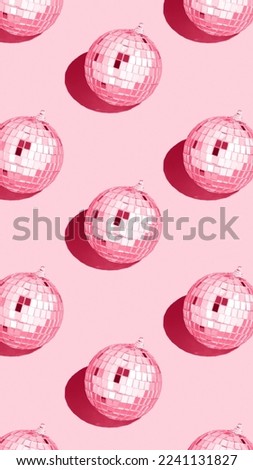Color of the year 2023 viva magenta.
Shiny disco ball. Creative Christmas pattern. 90s retro party time concept. Xmas holiday background. Top view. Flat lay.  Royalty-Free Stock Photo #2241131827