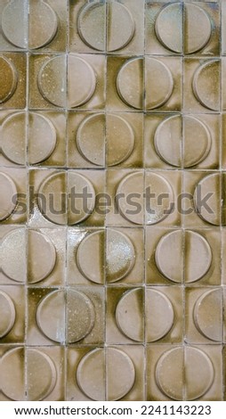 Retro relief tiles in a wall